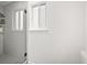 Tiled bathroom with glass enclosed shower and large window for ample natural light at 3881 S Bahama St, Aurora, CO 80013