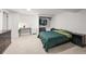 Bedroom with neutral carpet, a closet, dresser, desk, and green bedding at 3881 S Bahama St, Aurora, CO 80013