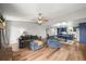 Spacious living room features hardwood floors, a ceiling fan, and an open floorplan at 3881 S Bahama St, Aurora, CO 80013