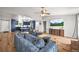 Open concept living space showcasing hardwood floors and an expansive layout with a vaulted ceiling at 3881 S Bahama St, Aurora, CO 80013