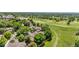 Aerial view of the home, street, and the adjacent community golf course and green spaces at 6375 S Jackson St, Centennial, CO 80121