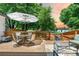 Back deck with table, chairs, umbrella, barbecue, and outdoor furnishings at 6375 S Jackson St, Centennial, CO 80121