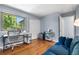 Bedroom with hardwood floors, a large window and closet space, ideal for a home office or guest room at 6375 S Jackson St, Centennial, CO 80121