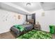 Cozy bedroom with a wood-frame bed and unique green rug at 6375 S Jackson St, Centennial, CO 80121