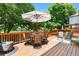 Spacious wooden deck with comfortable seating and a shaded dining area at 6375 S Jackson St, Centennial, CO 80121
