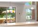 Bright dining area featuring a sliding glass door to the deck and many large windows for natural light at 6375 S Jackson St, Centennial, CO 80121