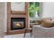 Close-up of a living room fireplace with warm lighting and cozy decor at 6375 S Jackson St, Centennial, CO 80121