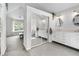 Spacious main bathroom with double sinks, a soaking tub, and a large closet with mirrors at 6375 S Jackson St, Centennial, CO 80121