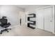 Neutral bedroom with carpet, closet, and modern bookshelf at 1245 Utica St # 104, Denver, CO 80204