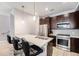 This stylish kitchen boasts stainless steel appliances, modern countertops, and barstool seating at 1245 Utica St # 104, Denver, CO 80204