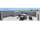 Rooftop deck offers modern seating and a hot tub, perfect for outdoor living and entertaining at 1245 Utica St # 104, Denver, CO 80204
