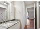 Bathroom featuring a granite vanity, and built in storage cabinets at 955 Eudora St # 505E, Denver, CO 80220
