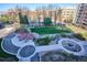 Aerial view of a community courtyard featuring walking paths and green spaces at 955 Eudora St # 505E, Denver, CO 80220