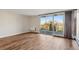 Bright living room featuring hardwood floors and large windows with views at 955 Eudora St # 505E, Denver, CO 80220