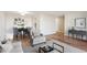 Inviting living and dining area with modern decor, wood floors, neutral colors, and an abundance of natural light at 955 Eudora St # 505E, Denver, CO 80220