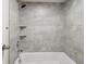 Modern shower with gray-toned tile and dual integrated wall shelves at 955 Eudora St # 505E, Denver, CO 80220
