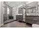 Spa-like bathroom with double vanities, modern fixtures, and a luxurious shower at 150 S Madison St # 303, Denver, CO 80209