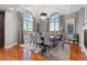 Formal dining room with hardwood floors, fireplace and oversized windows at 150 S Madison St # 303, Denver, CO 80209