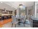 Bright dining room featuring large window, elegant chandelier, and modern decor at 150 S Madison St # 303, Denver, CO 80209