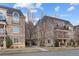 Stone condos featuring arched windows, wrought iron fencing and professionally maintained landscaping at 150 S Madison St # 303, Denver, CO 80209