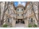 Elegant condo building exterior featuring stone accents and a charming turret entrance at 150 S Madison St # 303, Denver, CO 80209