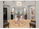 Grand foyer with designer tile flooring, columns and a statement chandelier at 150 S Madison St # 303, Denver, CO 80209