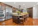 Spacious kitchen featuring dark wood cabinetry, stainless steel appliances, and granite countertops at 150 S Madison St # 303, Denver, CO 80209