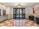 Inviting building lobby with tiled floors, neutral color scheme and secured entry at 150 S Madison St # 303, Denver, CO 80209