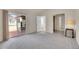 Bright bedroom with sliding glass door and access to en suite bathroom and closet at 11247 Wyandot St, Denver, CO 80234