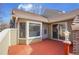 Exterior deck view with red stained lumber, brick and siding at 11247 Wyandot St, Denver, CO 80234
