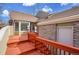 Exterior deck with red stained lumber, brick and siding at 11247 Wyandot St, Denver, CO 80234