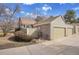 Charming exterior view of home with garage and well-manicured landscaping at 11247 Wyandot St, Denver, CO 80234
