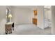 Cozy living room next to half bath including an ornate side table at 11247 Wyandot St, Denver, CO 80234
