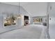 Bright living area featuring fireplace, large windows, and neutral tones at 11247 Wyandot St, Denver, CO 80234