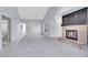 Open-concept living room with high ceilings and a cozy fireplace at 11247 Wyandot St, Denver, CO 80234