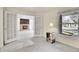 Inviting living room featuring a cozy brick fireplace and bright natural light at 11247 Wyandot St, Denver, CO 80234
