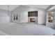 Bright living room featuring a vaulted ceiling and brick fireplace at 11247 Wyandot St, Denver, CO 80234