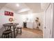 Basement wet bar with white cabinetry and wine cooler at 16930 E Wagontrail Pkwy, Aurora, CO 80015