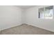 Bright basement bedroom with carpet and window at 16930 E Wagontrail Pkwy, Aurora, CO 80015