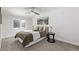 Bright bedroom with a cozy bed, window, and ceiling fan at 16930 E Wagontrail Pkwy, Aurora, CO 80015