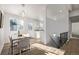 Modern dining area with a view of the kitchen and living room at 16930 E Wagontrail Pkwy, Aurora, CO 80015