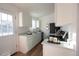 Modern kitchen with white cabinets, quartz countertops, and stainless steel appliances at 16930 E Wagontrail Pkwy, Aurora, CO 80015