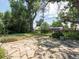 Backyard patio features natural stone and mature shade trees at 6310 Tennyson St, Arvada, CO 80003