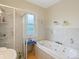 Relaxing bathroom featuring a jetted tub and a separate shower area at 6310 Tennyson St, Arvada, CO 80003