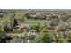 Scenic aerial view of houses with mature trees and a lush green landscape with mountains in the distance at 1322 Wicklow St, Boulder, CO 80303