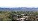 Expansive aerial view of homes with a stunning mountain range backdrop, perfect for nature lovers at 1322 Wicklow St, Boulder, CO 80303