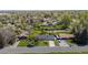 Aerial view of home with mature trees, lush landscaping, and a large garden area at 1322 Wicklow St, Boulder, CO 80303