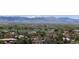 Panoramic aerial view of the homes and landscape with snow-capped mountains in the background at 1322 Wicklow St, Boulder, CO 80303