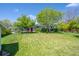 Well-manicured lawn with mature shade trees and landscaping at 1322 Wicklow St, Boulder, CO 80303
