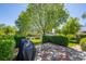 Beautiful backyard featuring a stone patio, privacy landscaping and a grill for outdoor cooking at 1322 Wicklow St, Boulder, CO 80303
